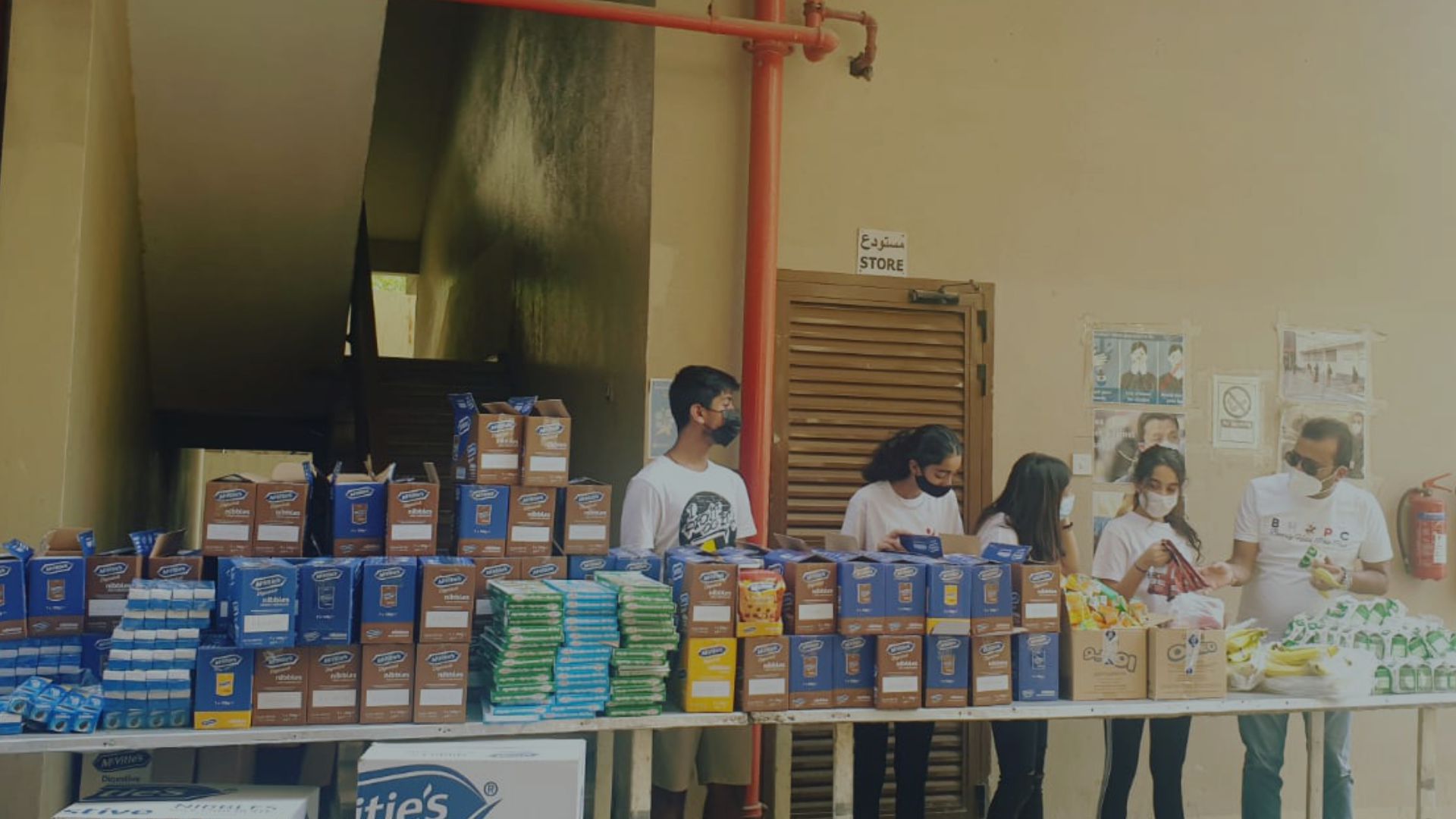 Volunteers distributing essentials